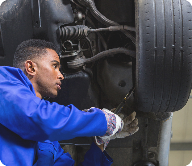 Mechanic fixing a car tyre